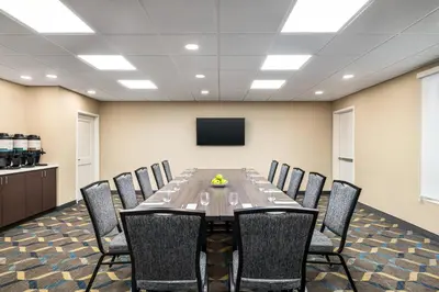 a conference room with a long table and chairs at Residence Inn by Marriott Mechanicsburg in Mechanicsburg