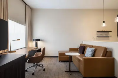 a living room with a couch and a table at Residence Inn by Marriott Mechanicsburg in Mechanicsburg