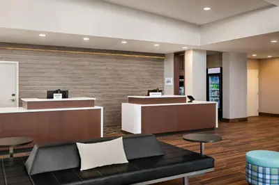 a lobby with a waiting area with a couch and chairs at Residence Inn by Marriott Mechanicsburg in Mechanicsburg