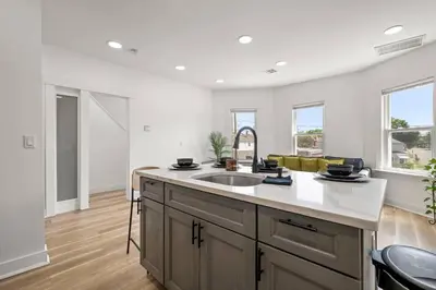 a kitchen with a sink and a counter top at NYC Access 4BR Duplex Sleeps 10, Free Parking in Fair Lawn