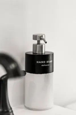 a hand soap dispenser sitting on a counter at NYC Access 4BR Duplex Sleeps 10, Free Parking in Fair Lawn