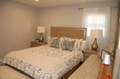 a bedroom with a bed with two lamps and a window at Welcome to our Retreat Haven in Warwick, NY in Warwick