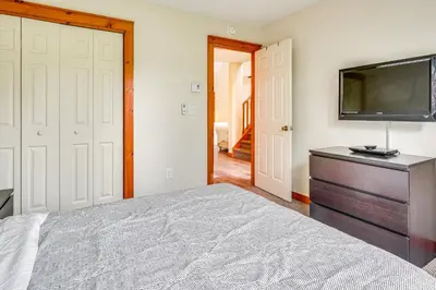 a bedroom with a bed and a flat screen tv at Tannersville Resort Home with Deck and Gas Grill! in Tannersville