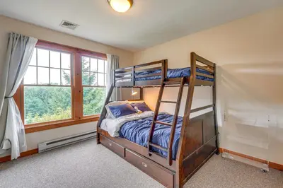 a bedroom with two bunk beds and a window at Tannersville Resort Home with Deck and Gas Grill! in Tannersville