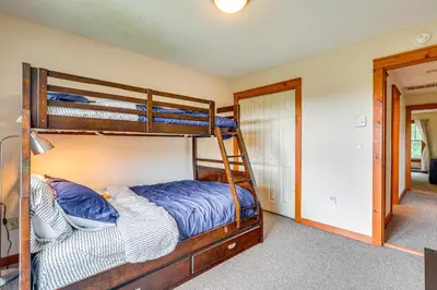 a bedroom with two bunk beds and a hallway at Tannersville Resort Home with Deck and Gas Grill! in Tannersville