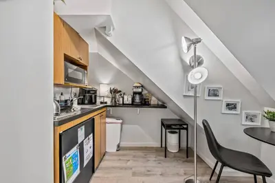 a kitchen with a counter and a dining room at Central Location Studio, Walk to Times Square in New York