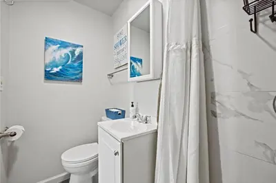 a white bathroom with a sink and a toilet at Central Location Studio, Walk to Times Square in New York