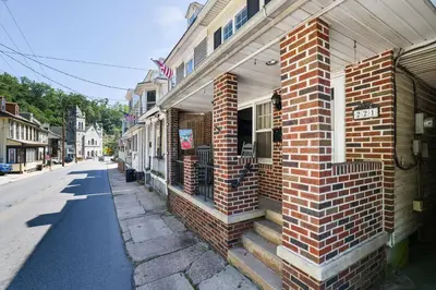 a brick building on the side of a street at Home on Broadway in Jim Thorpe in Jim Thorpe