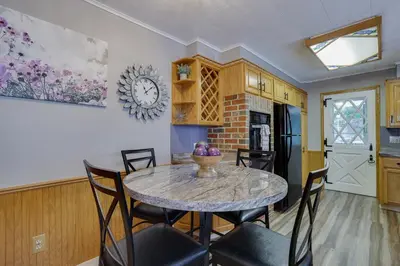 a kitchen and dining room with a table and chairs at Home on Broadway in Jim Thorpe in Jim Thorpe