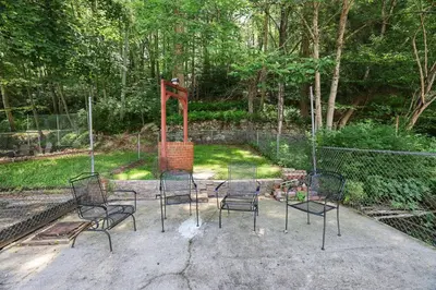 a group of chairs sitting in a courtyard at Home on Broadway in Jim Thorpe in Jim Thorpe