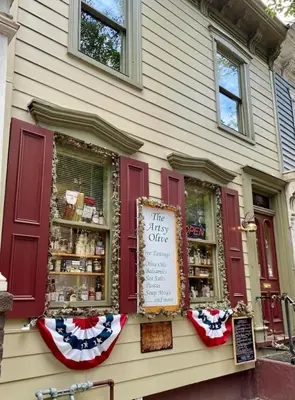 a store with a sign in the window of a building at In The Heart Of Jim Thorpe (with your own parking) in Jim Thorpe