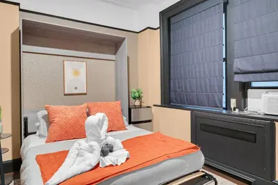 a bedroom with a bed with towels on it at Stunning Condo in Heart of New York with GYM & MORE in New York