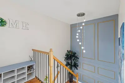 a room with a staircase with a blue door at Luxury Gated home near NYC and EWR with free Parking in Elizabeth