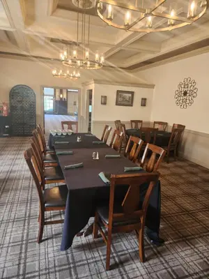 a conference room with a long table and chairs at Moselem Springs Golf Club in Kutztown
