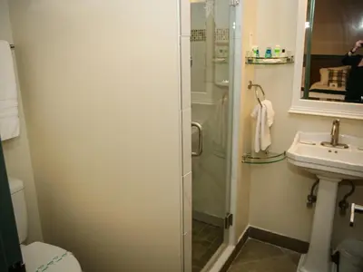 a bathroom with a shower and a sink at Moselem Springs Golf Club in Kutztown