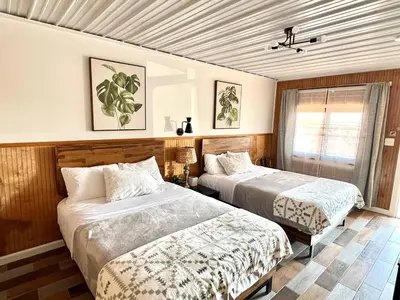 a bedroom with two beds and a window at High Point Mountain Motel in Wantage