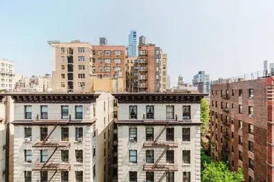 a group of tall buildings in a city at Blueground Greenpoint wd ac near ferry NYC-1538 in New York