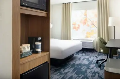 a hotel room with a bed and a window at Fairfield by Marriott Inn & Suites Union in Union