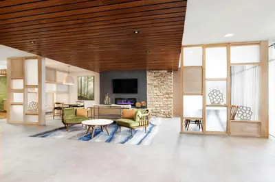 a living room with a couch and a table at Fairfield by Marriott Inn & Suites Union in Union