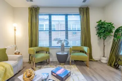 a living room with a couch and two chairs at Opulence in Olive with Free Parking plus EV Plug, 2 BR 2 baths Suite, 5 beds and Sleeps 8 in Orange