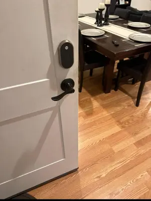 a door to a dining room with a table at Comfort Apartment Near Newark Airport in Newark