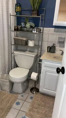 a bathroom with a toilet and a sink at Comfort Apartment Near Newark Airport in Newark