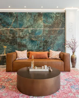 a living room with a brown couch and a table at Modern Marvel at University City in Philadelphia