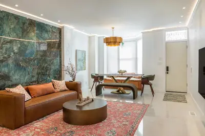 a living room with a couch and a table at Modern Marvel at University City in Philadelphia