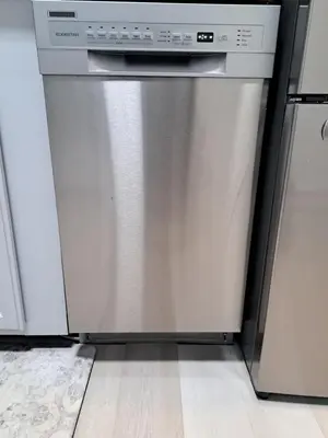 a stainless steel dishwasher in a kitchen with white cabinets at Fun Home in Pocono with Gameroom-Firpit-BBQ Grill-TV and AC in all rooms in Tobyhanna