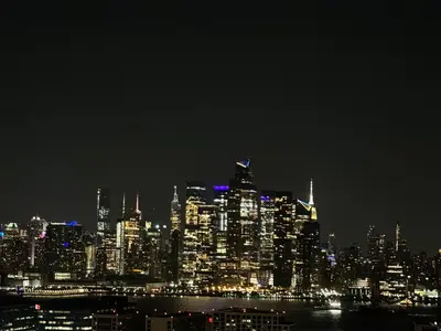 a nighttime view of a large city at night at Sunny Apt by the park Mins away from midtown New York in Jersey City