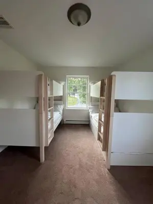 a room with white bunk beds and a window at Cozy Beautiful Pondside Luxurious Retreat in Monroe