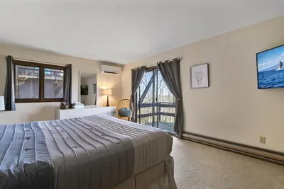 a bedroom with a bed and a large window at Pocono Mountain Village at Camelback 294 Overlook Way in Tannersville