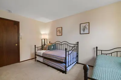 a bedroom with two beds and a door at Pocono Mountain Village at Camelback 294 Overlook Way in Tannersville