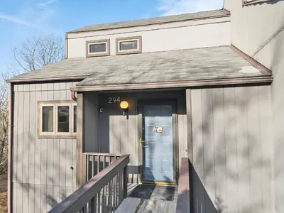 a front door of a house with a porch at Pocono Mountain Village at Camelback 294 Overlook Way in Tannersville