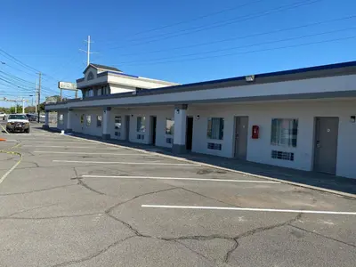 an empty parking lot in front of a building at Wilkes-Barre lodge in Wilkes-Barre