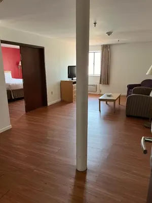 a living room with a pole in the middle of a room at Pottsville Hotel in Pottsville