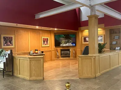 a large room with a bar in the middle of it at Pottsville Hotel in Pottsville