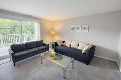a living room with a couch and a table at Comfort 2br2ba Monthly Discount in Elkins Park