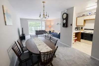 a dining room and living room with a table and chairs at Comfort 2br2ba Monthly Discount in Elkins Park