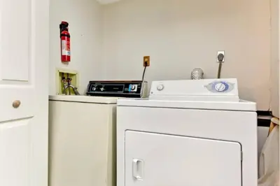 a kitchen with a white refrigerator and a microwave at Ski-In Ski-Out Camelback Village Townhouse - 100 YDS From The Mountain in Crescent Lake