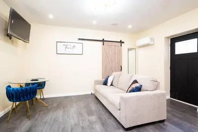 a living room with a couch and a table at 1BR Apt In Darby 18Min To Lincoln Financial Field in Darby