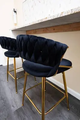 two chairs with blue seats sitting next to a counter at Charming 2BR Apt Balcony Views of Darby Creek in Darby