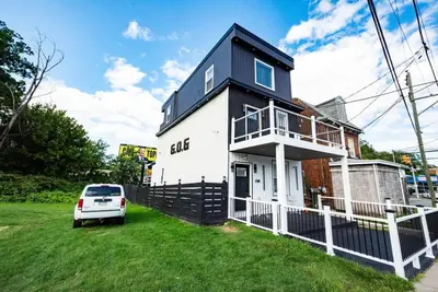 a house with a car parked in front of it at Charming 2BR Apt Balcony Views of Darby Creek in Darby