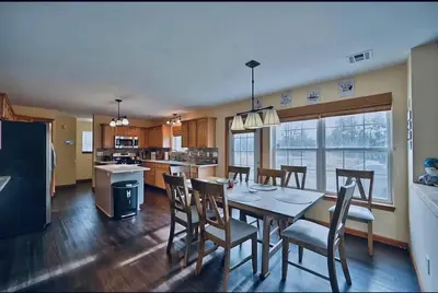 a kitchen and dining room with a table and chairs at Gorgeous Cozy 5 Bedroom House with Hottub,Lake,Pool in Albrightsville
