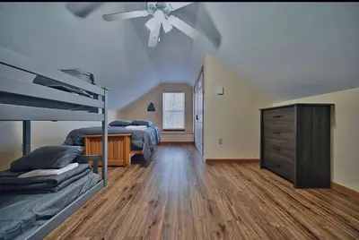 a bedroom with two beds and a ceiling fan at Gorgeous Cozy 5 Bedroom House with Hottub,Lake,Pool in Albrightsville
