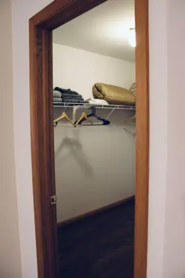 a closet with a mirror and a closet with clothes at Gorgeous Cozy 5 Bedroom House with Hottub,Lake,Pool in Albrightsville