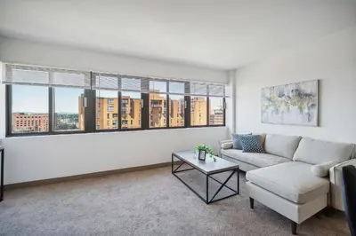 a living room with a couch and a table at PP 1002 Modern Corporate 2br, pool, Gym in Harrisburg