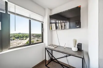 a room with a table and a large window at PP 1301 Modern Corporate 2br, pool, Gym in Harrisburg