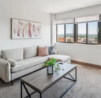 a living room with a couch and a coffee table at PP 1301 Modern Corporate 2br, pool, Gym in Harrisburg