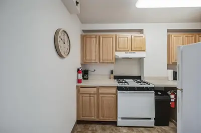a kitchen with a stove and a refrigerator at PP 1306 Modern Corporate 1br, pool, Gym in Harrisburg